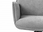 Sillón giratorio con reposabrazos, asiento en tela y respaldo en polipiel