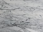 Mesa auxiliar redonda de mármol y hierro