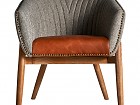 Sillón de estilo retro combinado con asiento de piel