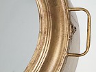 Espejo de pared de metal dorado
