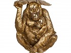Figura decorativa mono dorado de resina